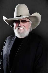 Charlie Daniels black shirt and cowboy hat